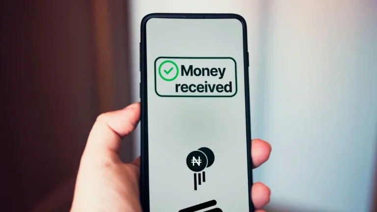 Smartphone showing a successful bank-to-bank money transfer, illustrating digital financial transactions