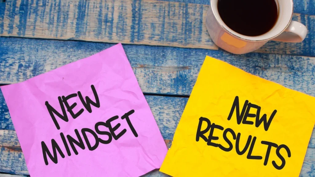 New mindset, new results motivational quote on a desk.